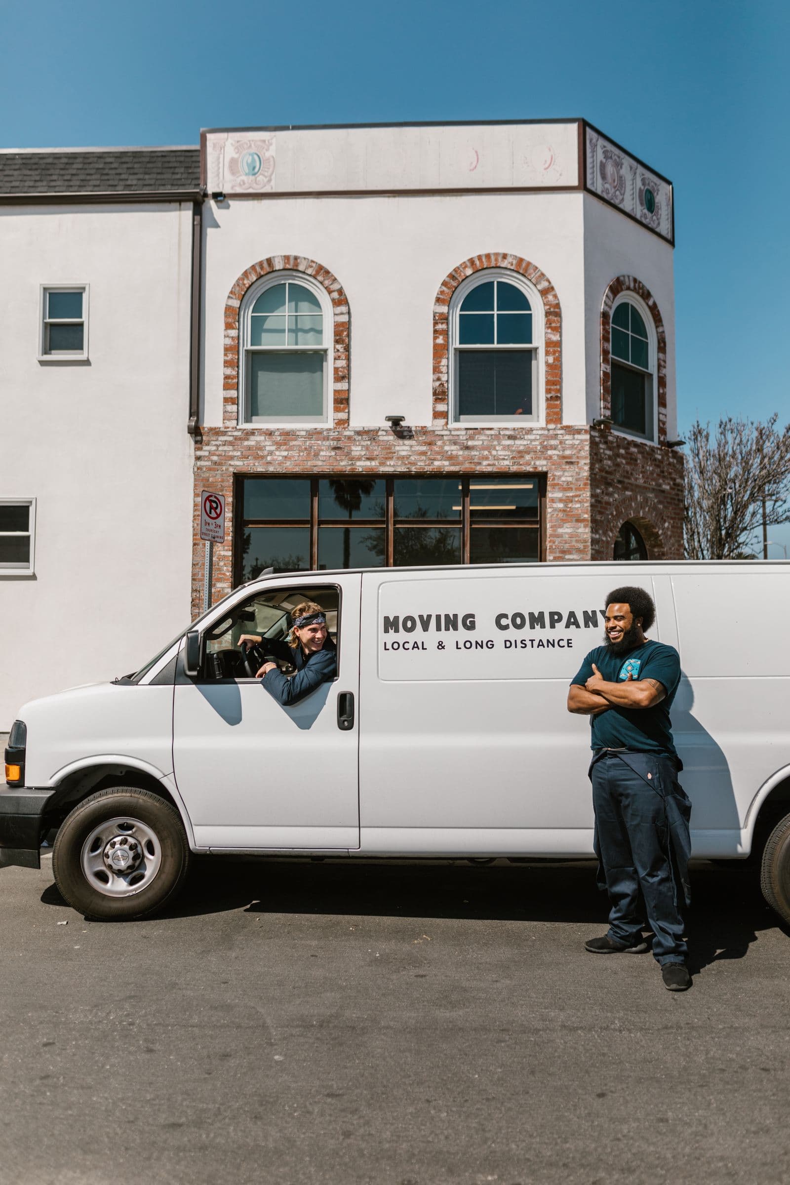 Vantage moving crew standing beside their moving van